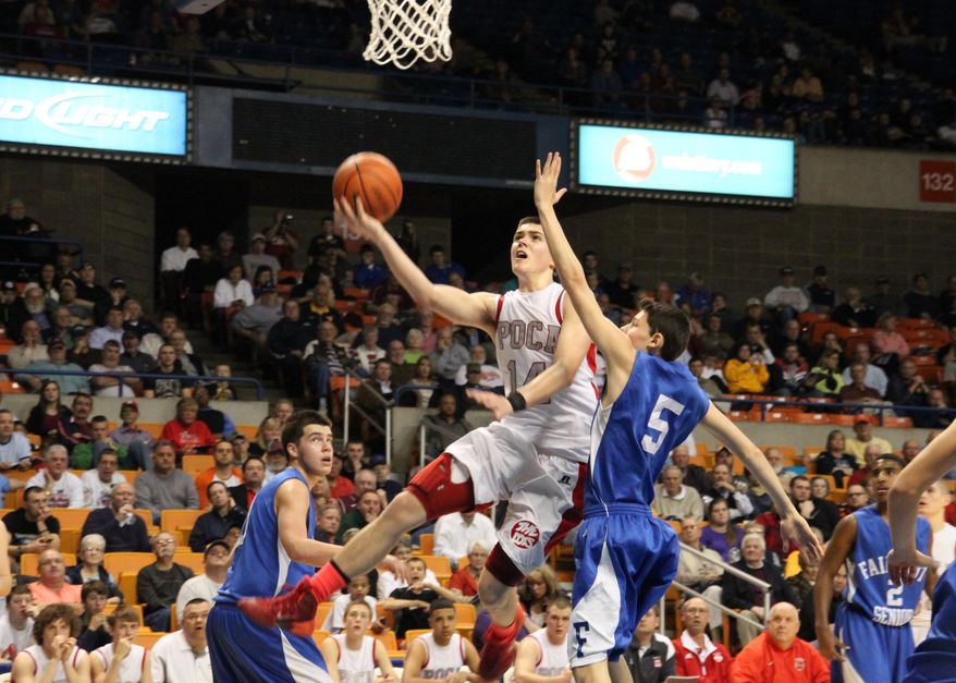 In this Wednesday, March 19, 2014 photo, Poca High School's Luke Frampton drives to the basket against the defense of Fairmont's Brennan Moorehead (5) during a West Virginia Class AA boys tournament basketball game in Charleston, W.Va. Brothers Luke and Noah Frampton take turns wearing the No. 34 used by their father, Bryan Frampton, who played for the Dots in the 1980s, and who died in December. (AP Photo/The Putnam Standard, Kelly Stadelman) NO SALES