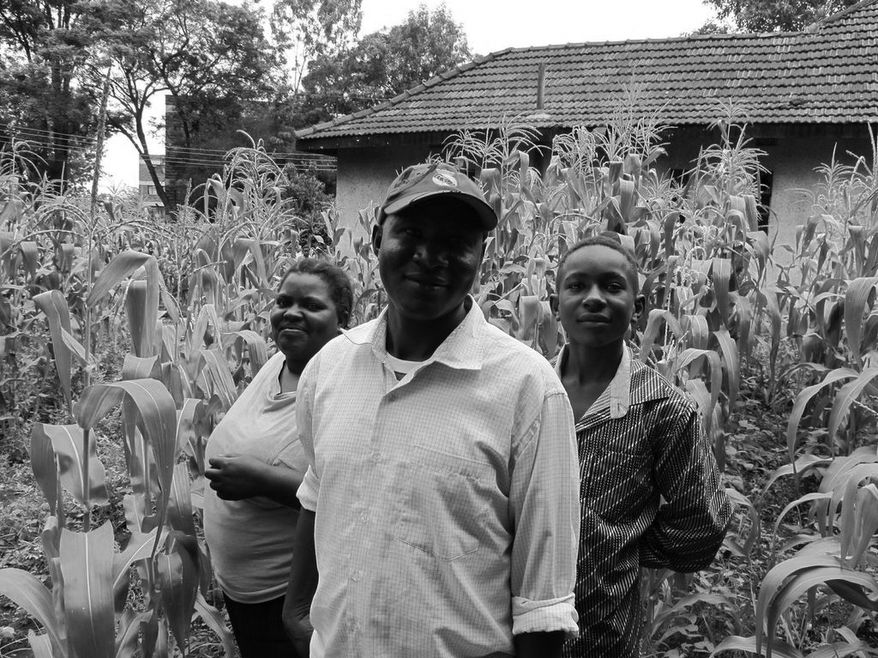 Gladys Mwende, Benson Muthame and their son cultivate one acre in Nairobi, despite lacking title to the land. (Credit: Olu Akintorln)