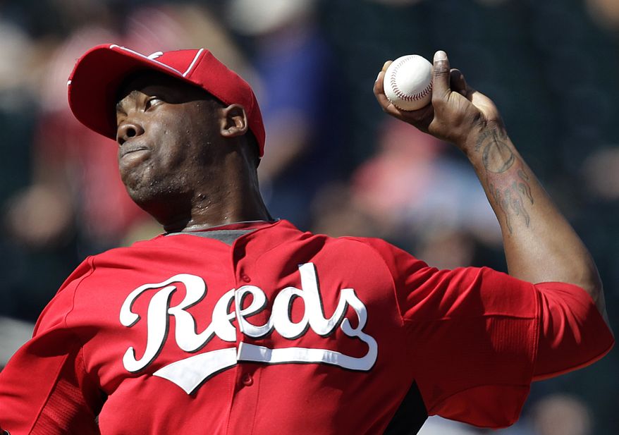 FILE - Cincinnati Reds relief pitcher Aroldis Chapman throws in the third inning of a spring training baseball game against the Cleveland Indians in Goodyear, Ariz., in this March 4, 2012 file photo. Chapman was hit in the face by a line drive Wednesday night March 19, 2014 and taken to a hospital with a cut above his left eye. (AP Photo/Jae C. Hong, File)
