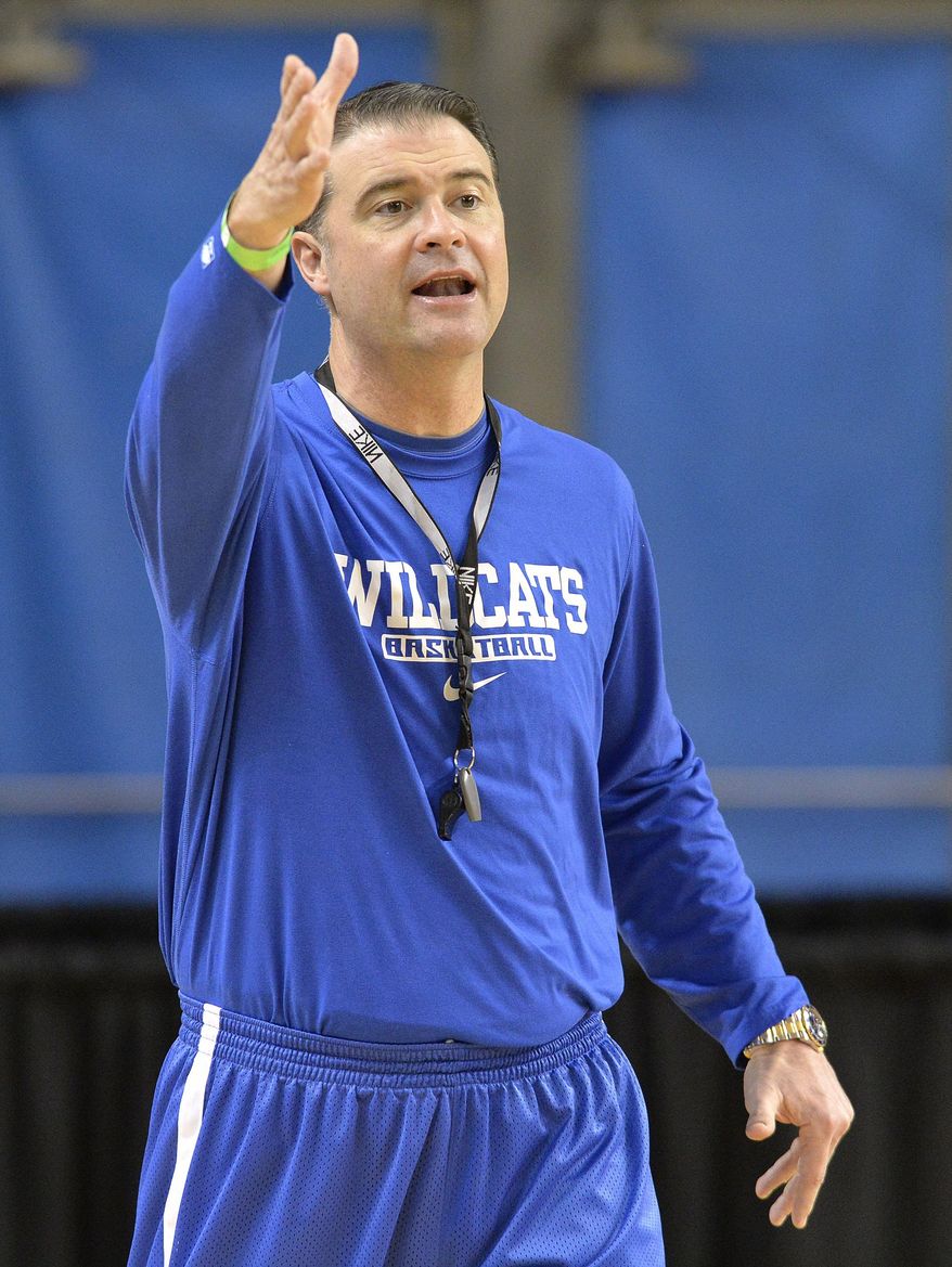 Kentucky head coach Matthew Mitchell directs his team during practice for the NCAA women&#x27;s college basketball tournament in Lexington, Ky., Friday, March 21, 2014. Kentucky plays Wright State in a first-round game Saturday.  (AP Photo/Timothy D. Easley)