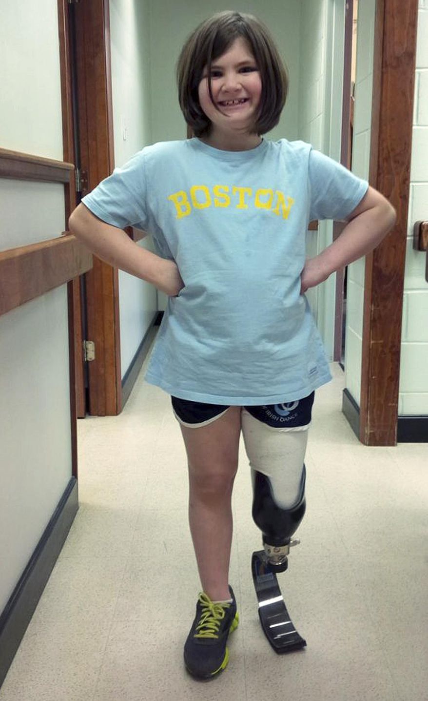 This photo released Friday, March 21, 2014, by the Richard family shows daughter Jane Richard wearing prosthetic leg fitted the preceding week in Boston. Jane and her mother were injured when a bomb exploded near the finish line of the Boston Marathon on April 15, 2013. Her brother, Martin Richard, was one of three people killed in the bombings. The 118th Boston Marathon is scheduled for April 21, 2014. (AP Photo/Richard Family)