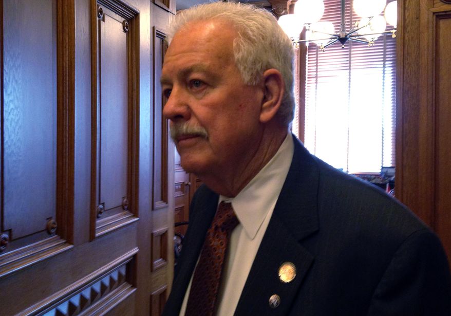 Kansas House Speaker Ray Merrick, a Stilwell Republican, answers questions from reporters about a new House GOP school funding plan, Thursday, March 20, 2014, at the Statehouse in Topeka, Kan. The plan ties full funding for aid to poor school districts with school "choice" initiatives. (AP Photo/John Hanna)