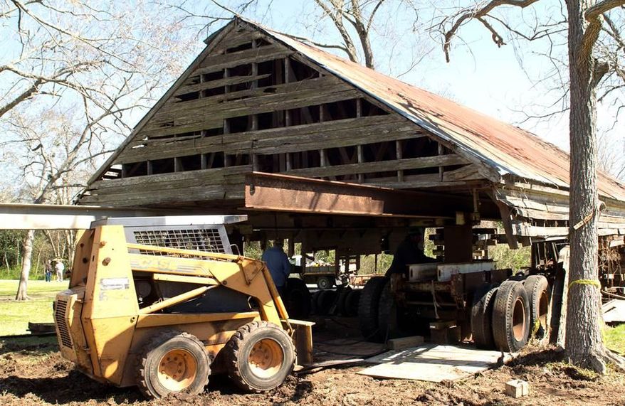 A 25-foot-wide, 50-foot-long wooden rectangle building that faces the Brazos River, sits in a small, four-house neighborhood established in 1846. Originally a post office, the building has been used for purposes other than what was intended for it, including at various times a bar and grocery store. The building has been gutted and currently has no walls, with the trussed, metal roof held up by construction equipment to allow workers to repair the foundation. (AP Photo/The Brazosport Facts, Kellie Marriot)