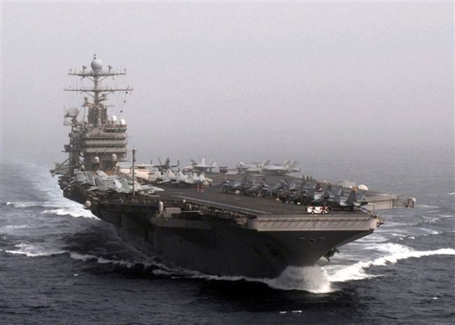 ** FILE ** The aircraft carrier USS Abraham Lincoln transits the Arabian Sea Dec. 5, 2010, while conducting flight operations. (U.S. Department of Defense)