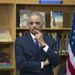 Attorney General Eric Holder participates in a discussion on the importance of universal access to preschool and the need to reduce &quot;unnecessary and unfair school discipline practices and other barriers to equity and opportunity at all levels of education&quot; Friday, March 21, 2014, at J. Ormond Wilson Elementary School library in Washington. (AP Photo/Cliff Owen)