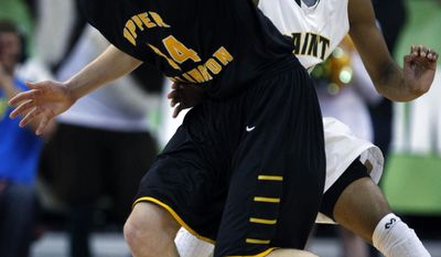 Upper Arlington&#39;s Logan Richter, left, tries to get around Lakewood St. Edward&#39;s Mike Ryan during the first quarter of the OHSAA Division I boys&#39; high school basketball championship game in Columbus, Ohio, Saturday, March 22, 2014. (AP Photo/Paul Vernon)