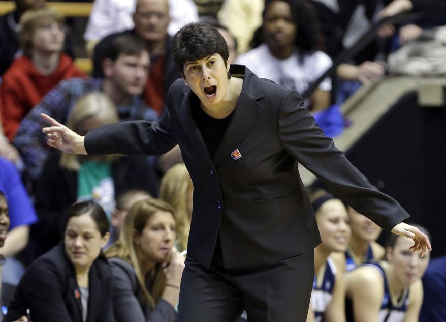 Akron head coach Jodi Kest yells to her team as they played against Purdue during the second half of a first-round game in the NCAA women's college basketball tournament in West Lafayette, Ind., Saturday, March 22, 2014. Purdue defeated Akron 84-55. (AP Photo/Michael Conroy)