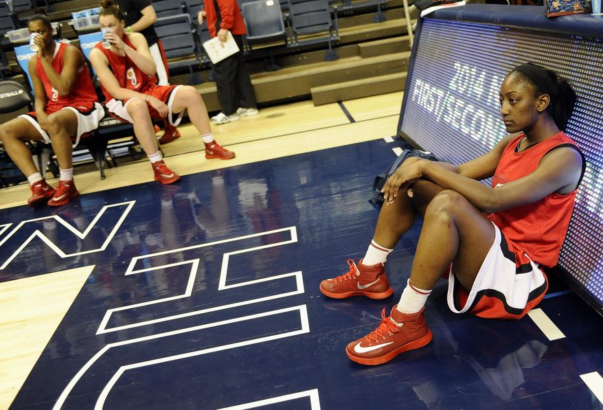 Georgia's Erika Ford, right, takes a break during practice at the NCAA women's college basketball tournament, Saturday, March 22, 2014, in Storrs, Conn. Georgia plays Saint Joseph's in a first-round game on Sunday. (AP Photo/Jessica Hill)