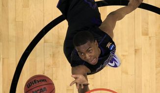 Kansas State&#39;s Wesley Iwundu heads to the basket during the second half of a second-round game against Kentucky in the NCAA college basketball tournament Friday, March 21, 2014, in St. Louis. Kentucky won 56-49. (AP Photo/Jeff Roberson)