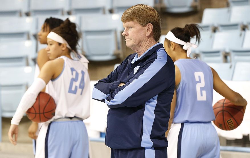 North Carolina Head Coach Andrew Calder watches his team during practice for the NCAA women's college basketball tournament in Chapel Hill, N.C., March 22, 2014. North Carolina plays UT-Martin in a first-round game on Sunday. (AP Photo/Ellen Ozier)