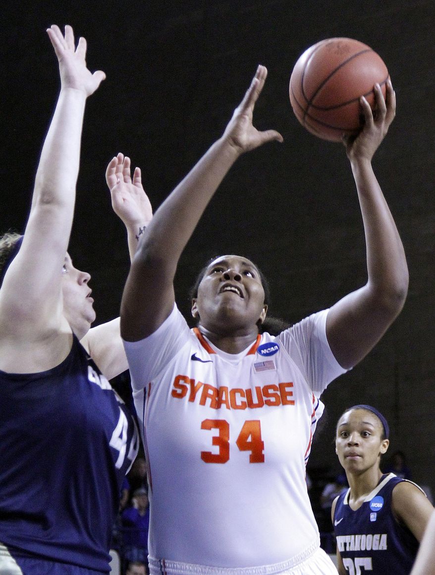 Syracuse's Shakeya Leary (34) shoots as Chattanooga's Ashlen Dewart defends during the first half of a first-round NCAA college basketball game in Lexington, Ky., Saturday, March 22, 2014. (AP Photo/James Crisp)