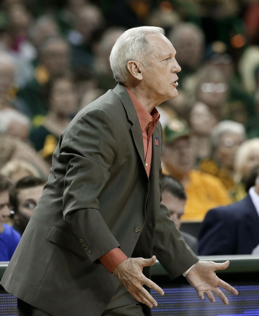 Baylor associate head coach Bill Brock argues a call against his team with an official in the first half of a first-round game in the NCAA women's college basketball tournament against Western Kentucky, Saturday, March 22, 2014, in Waco, Texas. Brock coached the game, since coach Kim Mulkey was suspended after criticizing officiating in the 2013 NCAA tournament. (AP Photo/Tony Gutierrez)