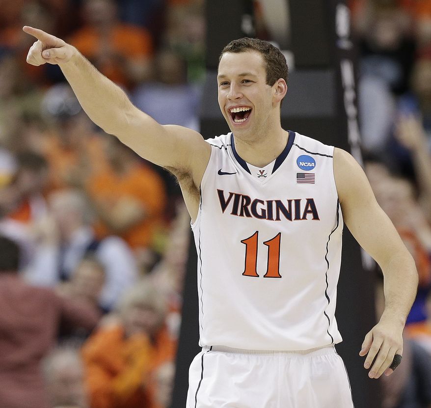 Virginia forward Evan Nolte (11) celebrates a goal against Coastal Carolina during the second half of an NCAA college basketball second-round tournament game, Friday, March 21, 2014, in Raleigh. Virginia won 70-59. (AP Photo/Chuck Burton)