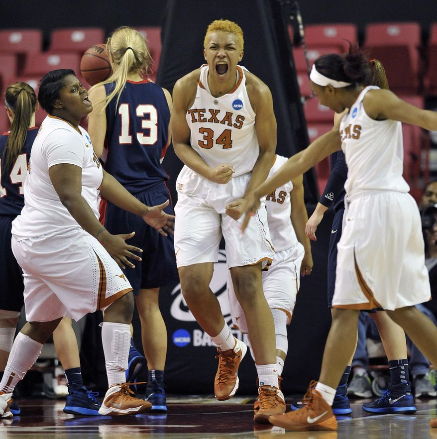 Texas players, from left to right, Nekia Jones, Imani McGee-Stafford and Empress Davenport celebrate a basket against Penn during the second half of the first round of the NCAA women's college basketball tournament on Sunday, March 23, 2014, in College Park, Md. Texas won 79-61. (AP Photo/Gail Burton)