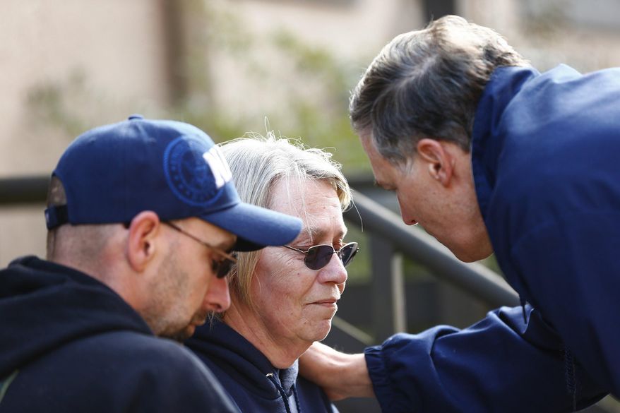 Washington Governor Jay Inslee talks privately with two residents personally affected by the mudslide after a media presser at Arlington City Hall on Sunday, March 23, 2014, the day after a giant landslide occurred near Oso, Wash. on Highway 530. At least six homes have been washed away, with three people reported dead so far and at least eight people transported to a local hospital. Others were reportedly still trapped in the wreckage Sunday morning. The nearby Stillaguamish River has been dammed up by 15-20 feet of debris as a result, creating more flooding concerns, as reported by KING 5 via the state hydrologist. (AP Photo/The Seattle Times, Lindsey Wasson, Pool)