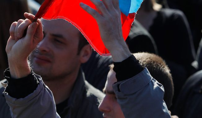 Deja Vu: About 5,000 people demonstrated Sunday in Donetsk, in eastern Ukraine, in favor of holding a referendum on secession and absorption into Russia, just as Crimeans did earlier this month before their region was annexed. President Obama this week will work for a united front against Russian President Vladimir Putin. (Associated Press)