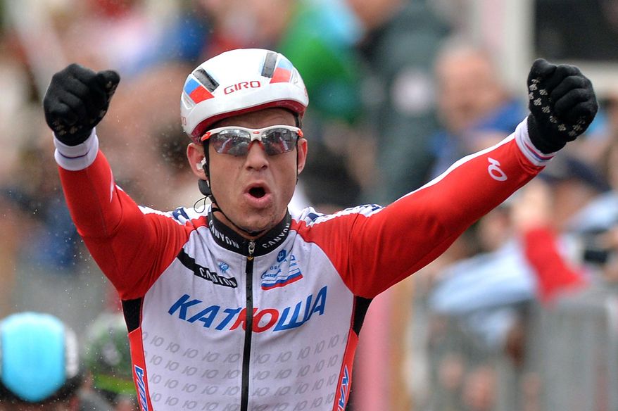 Norway's Alexander Kristoff celebrates as he crosses the finish line to win the Milan-San Remo cycling race, in Sanremo, Italy, Sunday, March 23, 2014. Alexander Kristoff sprinted to victory in the Milan-San Remo classic on Sunday, edging out 2008 winner Fabian Cancellara on a wet and rainy course for the biggest win of his career. Kristoff pulled away in the closing meters to win the 294-kilometer (183 mile) race in 6 hours, 55 minutes, 56 seconds and become the first Norwegian to triumph in the one-day race. (AP Photo/Gian Mattia D'Alberto, Lapresse)