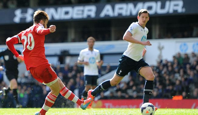 Southampton&#x27;s Adam Lallana, left, scores his team&#x27;s second goal of the game during the English Premier League soccer match against Tottenham Hotspurs at White Hart Lane, London Sunday March 23, 2014. (AP {Photo/Adam Davy/PA) UNITED KINGDOM OUT