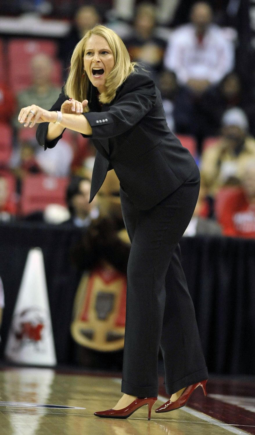 Maryland coach Brenda Frese calls to an official during the first half of the first-round game against Army in the NCAA women's college basketball tournament on Sunday, March 23, 2014, in College Park, Md. Maryland won 90-52. (AP Photo/Gail Burton)