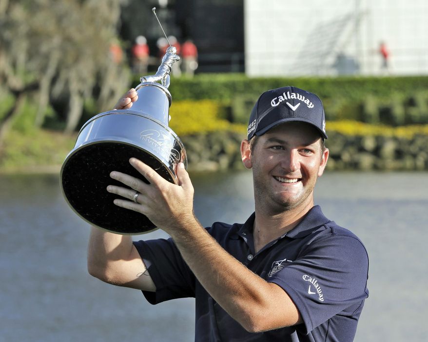 Matt Every holds up the trophy after winning the Arnold Palmer Invitational golf tournament at Bay Hill, Sunday, March 23, 2014, in Orlando, Fla. (AP Photo/Chris O'Meara)