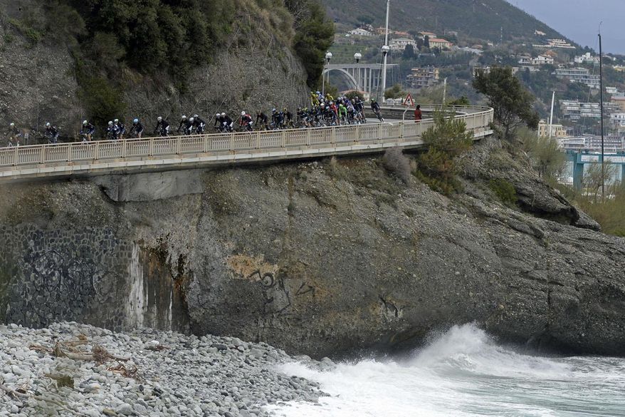 Cyclists ride along the coastline during the Milan-San Remo cycling race, in Sanremo, Italy, Sunday, March 23, 2014. Alexander Kristoff sprinted to victory in the Milan-San Remo classic on Sunday, edging out 2008 winner Fabian Cancellara on a wet and rainy course for the biggest win of his career. Kristoff pulled away in the closing meters to win the 294-kilometer (183 mile) race in 6 hours, 55 minutes, 56 seconds and become the first Norwegian to triumph in the one-day race. (AP Photo/Fabio Ferrari, Lapresse)