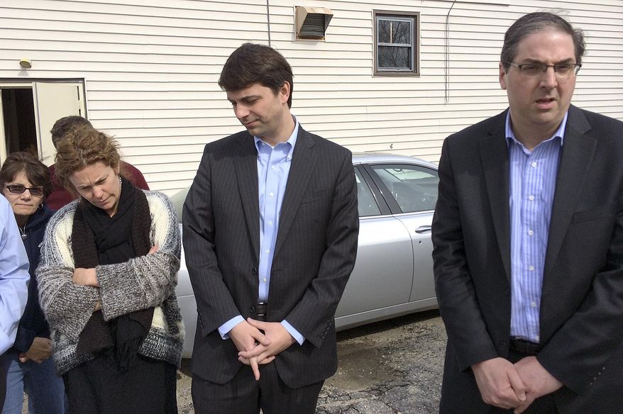 Rhode Island Democratic Rep. Michael Marcello, right, speaks to reporters beside Rep. Christopher Blazejewski, center, and supporters outside a firemen's hall, Sunday, March 23, 2014 in Johnston, R.I. Marcello is seeking the speaker of the House position after Speaker Gordon Fox relinquished it Saturday following twin raids Friday at his Statehouse office and home as part of a criminal investigation. Officials will not say whom or what they are investigating. Blazejewski is Marcello's choice for majority leader. A formal House vote is expected Tuesday. (AP Photo/Erika Niedowski)