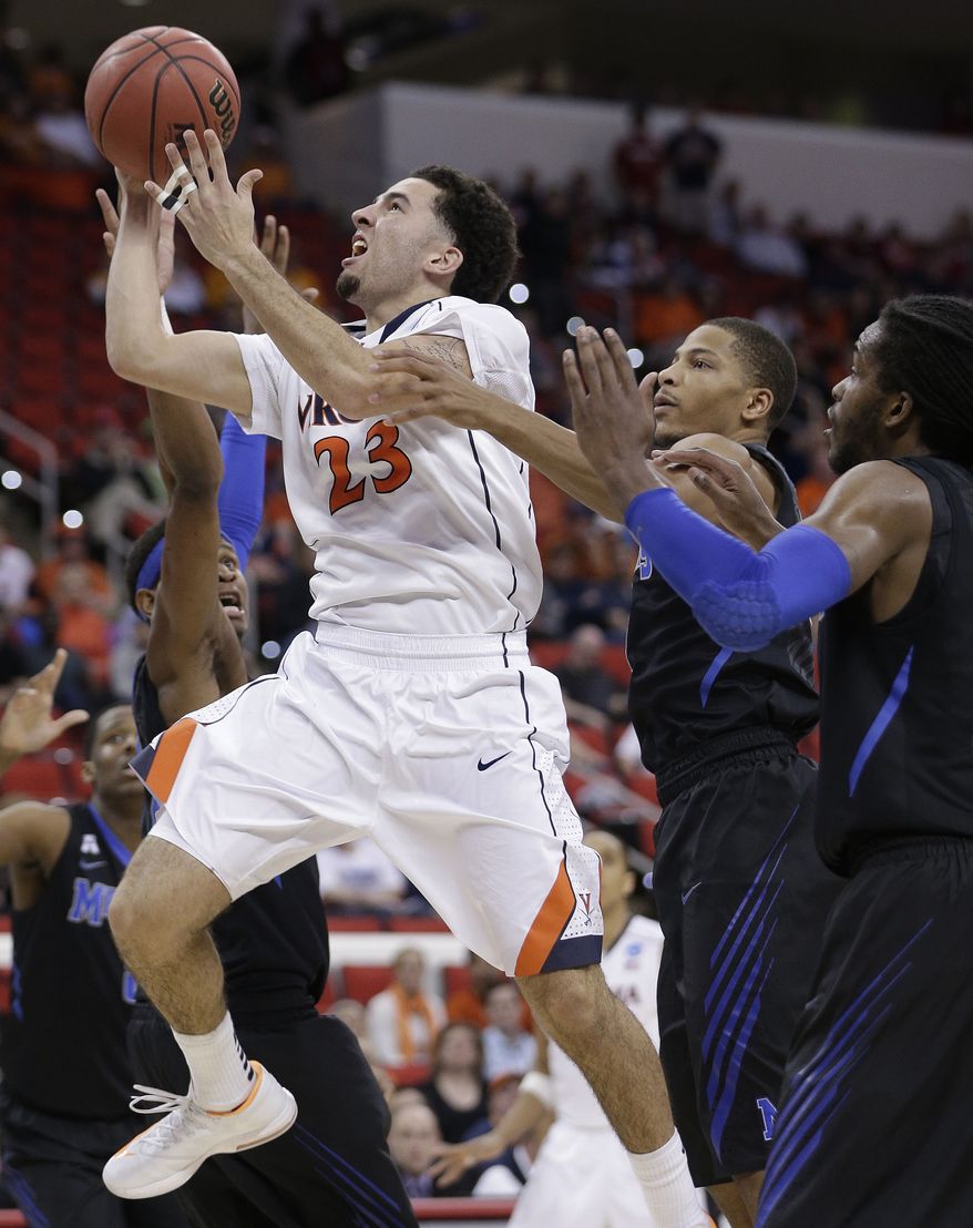 Virginia guard London Perrantes (23) shoots against Memphis during the second half of an NCAA college basketball third-round tournament game, Sunday, March 23, 2014, in Raleigh, N.C. (AP Photo/Chuck Burton)