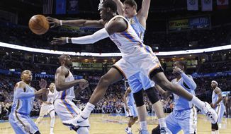 Oklahoma City Thunder guard Reggie Jackson (15) passes from under the basket in front of Denver Nuggets center Timofey Mozqov (25) in the first quarter of an NBA basketball game in Oklahoma City, Monday, March 24, 2014. (AP Photo/Sue Ogrocki)