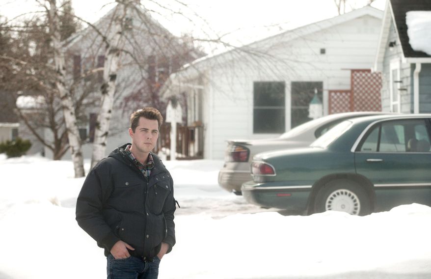 Bob Brellenthin of Pahlen Realty stands in a residential area of Roseau, Minn. on Thursday, March 20, 2014. No Minnesota community has been affected more by the nationwide spike in flood insurance premiums than the far northwestern city of Roseau, where the specter of rates rising by as much as $400 to a monthly home payment has just about dried up the local housing market. Nearly the entire community lies within the Roseau River flood plain, hard-hit by a major flood in 2002, so mortgage lenders require purchasers to take out flood insurance. (AP Photo/Bruce Crummy)