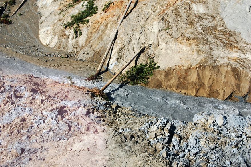 This March 23, 2014 photo, made available by the Washington State Dept of Transportation shows a view of the damage from Saturday's mudslide in Oso, Wash. At least eight people were killed in the 1-square-mile slide that hit in a rural area about 55 miles northeast of Seattle on Saturday. Several people also were critically injured, and about 30 homes were destroyed. (AP Photo/Washington State Dept of Transportation)