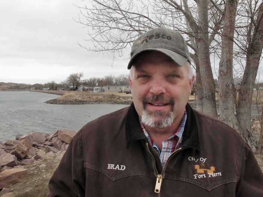Brad Lawrence, director of public works for the city of Fort Pierre, stands on the Missouri River floodplain in Fort Pierre, S.D. on Friday, March 21, 2014. He says more than 1,600 South Dakota residents will see their subsidized rates from the National Flood Insurance Program increase substantially, even with a measure signed by President Barack Obama that eases the initial burden set in a 2012 law. "This is going to be a problem here in South Dakota," Lawrence said. "I don't know if any of them understand the predicament they're in." (AP Photo)