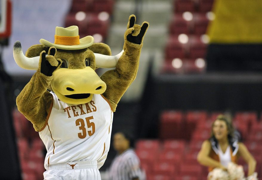 The Texas mascot dances during a timeout in the second half of game against Penn in the first round of the NCAA women's college basketball tournament on Sunday, March 23, 2014, in College Park, Md. Texas won 79-61. (AP Photo/Gail Burton)