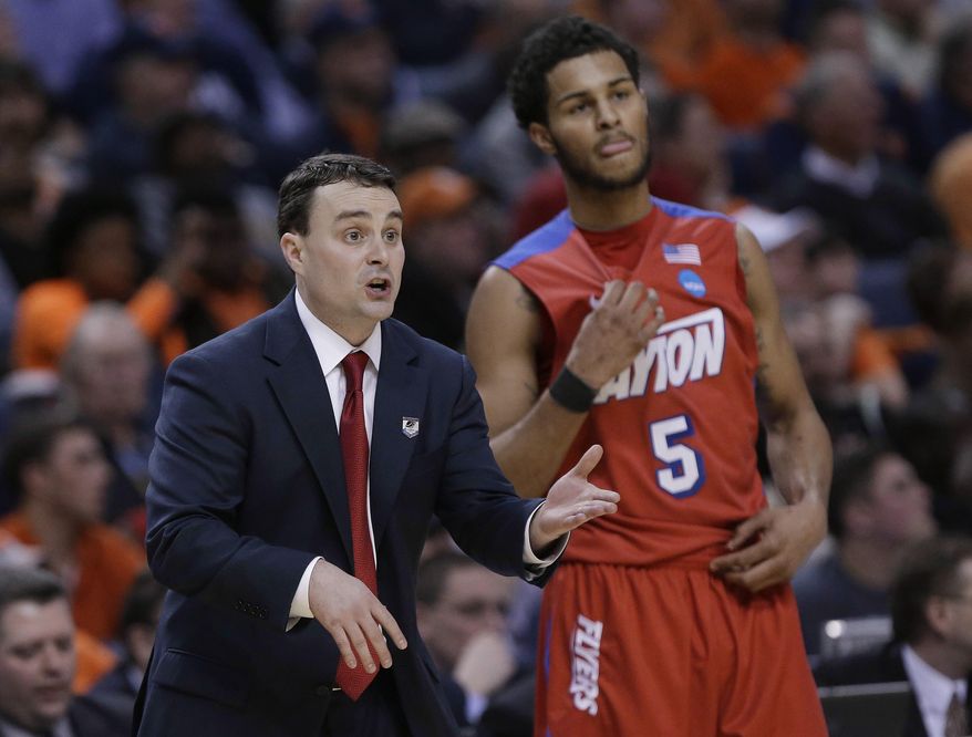 Dayton coach Archie Miller calls out to his team as Devin Oliver (5) listens during the first half of a third-round game against Syracuse in the NCAA men&#39;s college basketball tournament in Buffalo, N.Y., Saturday, March 22, 2014. (AP Photo/Frank Franklin II)