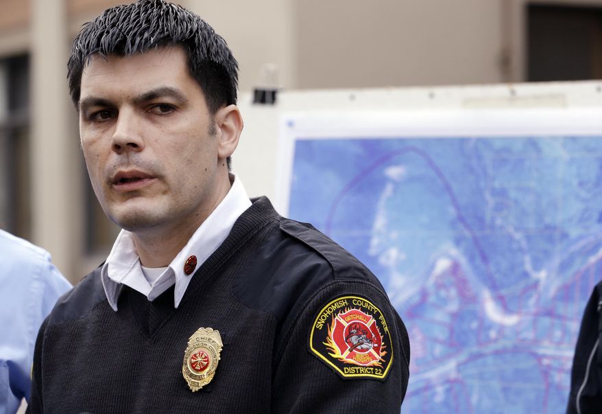 Snohomish County Fire District 21/22 Chief Travis Hot speaks during a news conference about a deadly mudslide that happened two days earlier, Monday, March 24, 2014, in Arlington, Wash. Officials said that there are currently 108 names of people who have been reported missing or are unaccounted for from the Saturday morning slide, but cautioned the figure would likely decline dramatically. Eight people are so far confirmed dead from the one-square mile slide that destroyed about 30 homes and critically injured several people. (AP Photo/Elaine Thompson)