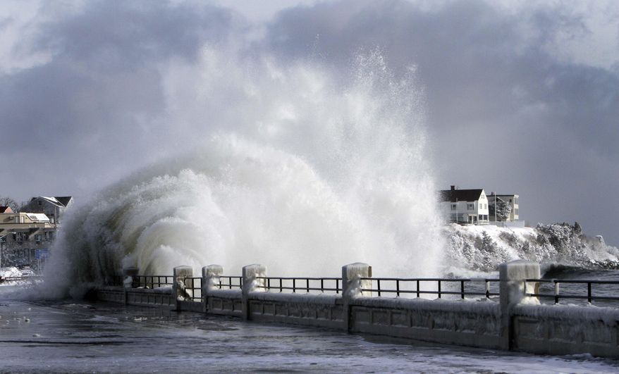 FILE - In this Friday, Jan. 3, 2014 file photo, heavy surf breaks over a seawall during a winter storm in Hampton, N.H. More than 40 percent of the properties with flood insurance in New Hampshire will see their costs go up in 2014 due to changes in the National Flood Insurance Program. Homeowners will see their rates go up as much as 18 percent each year and owners of businesses and second homes will face an annual mandatory 25 percent rate increase until they switch to a risk-based rate. (AP Photo/Jim Cole)