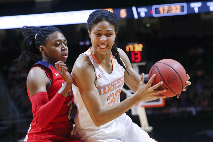 Tennessee center Isabelle Harrison (20) drives against St. John's forward Amber Thompson, left, in the first half of an NCAA women's college basketball second-round tournament game Monday, March 24, 2014, in Knoxville, Tenn. (AP Photo/John Bazemore)