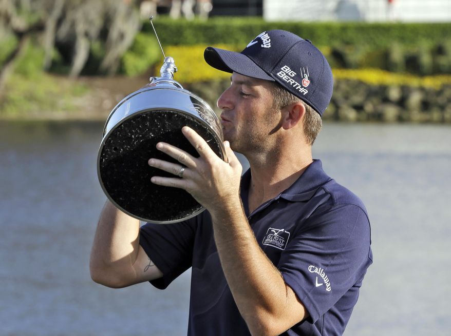 Matt Every kisses the trophy after winning the Arnold Palmer Invitational golf tournament at Bay Hill, Sunday, March 23, 2014, in Orlando, Fla. (AP Photo/Chris O'Meara)