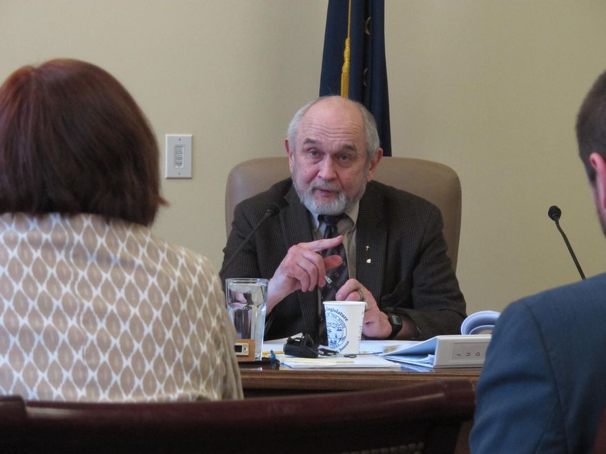 Sen. Fred Dyson, R-Eagle River, speaks during a Senate Judiciary hearing on Monday, March 24, 2014, in Juneau, Alaska, on a resolution urging the state and federal governments to seek additional money for restoration arising from the Exxon Valdez oil spill. Also shown, from left, are Sen. Berta Gardner, the sponsor of the measure, and her aide Noah Hanson. (AP Photo/Becky Bohrer)