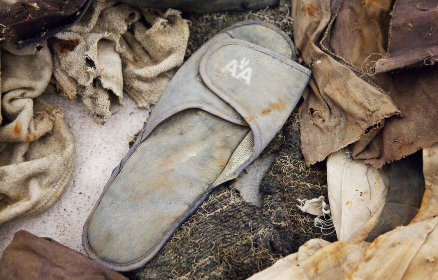 FILE - In this file photo of June 19, 2011, an American Airlines slipper is stored in Hangar 17 at John F. Kennedy International Airport in New York. The slipper is an artifact from the September 11, 2001 attacks that is to be part of the National September 11 Museum. The long-awaited museum dedicated to the victims of the Sept. 11 terror attacks will open to the public at the World Trade Center site on May 21, officials announced Monday, March 24, 2014. (AP Photo/Mark Lennihan, File)