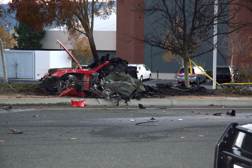 In this Nov. 30, 2013 photo released by the Los Angeles County Sheriff Department on Tuesday, March 25, 2014, shows the wreckage of a Porsche that crashed into a light pole in Valencia, Calif. Crash investigators have determined that the car carrying "Fast & Furious" star Paul Walker was traveling approximately 90 mph when it lost control on a city street and smashed into a light pole, killing the actor and his friend Roger Rodas. A person who has reviewed the investigators’ report told The Associated Press that it concluded unsafe driving, not  mechanical problems, caused the crash. The person requested anonymity because the report has not been officially released yet. (AP Photo/Los Angeles County Sheriff)