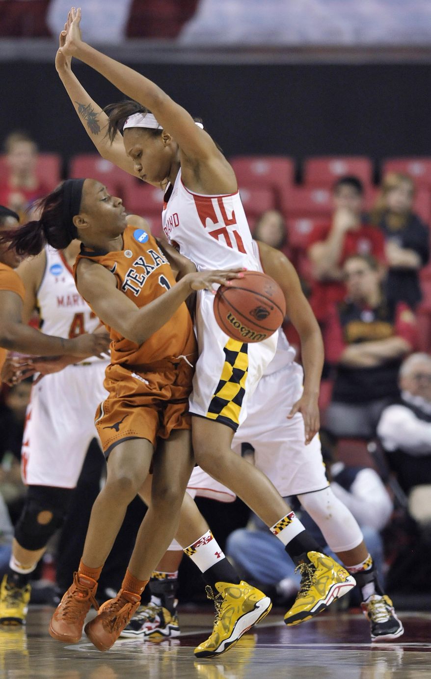 Texas' Empress Davenport, left, is fouled by Maryland's Alicia DeVaughn during the second half of a second-round game of tghe NCAA women's college basketball tournament, Tuesday, March 25, 2014, in College Park, Md. Maryland won 69-64. (AP Photo/Gail Burton)