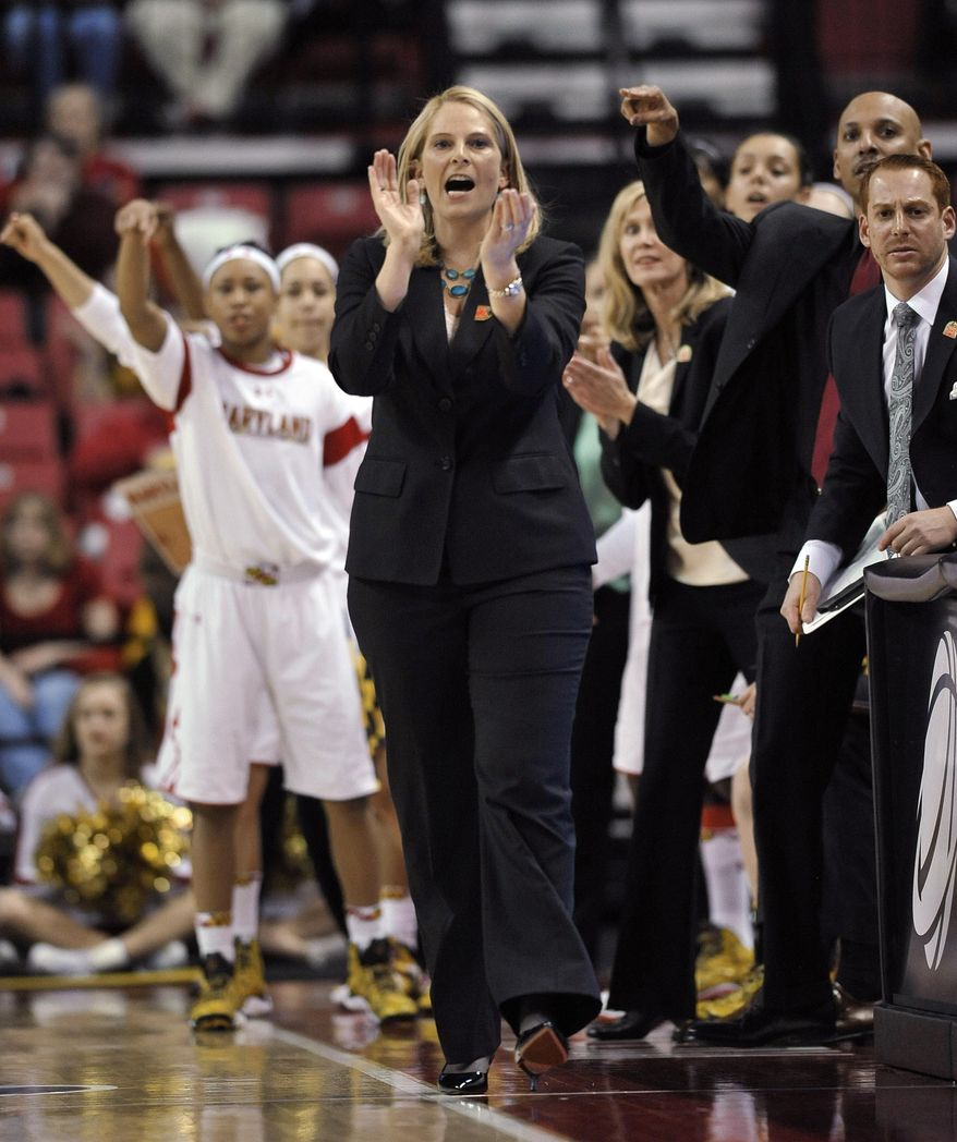 Maryland coach Brenda Frese cheers her team against Texas during the first half of a second-round game of the NCAA women's college basketball tournament, Tuesday, March 25, 2014, in College Park, Md. Maryland won 69-64. (AP Photo/Gail Burton)