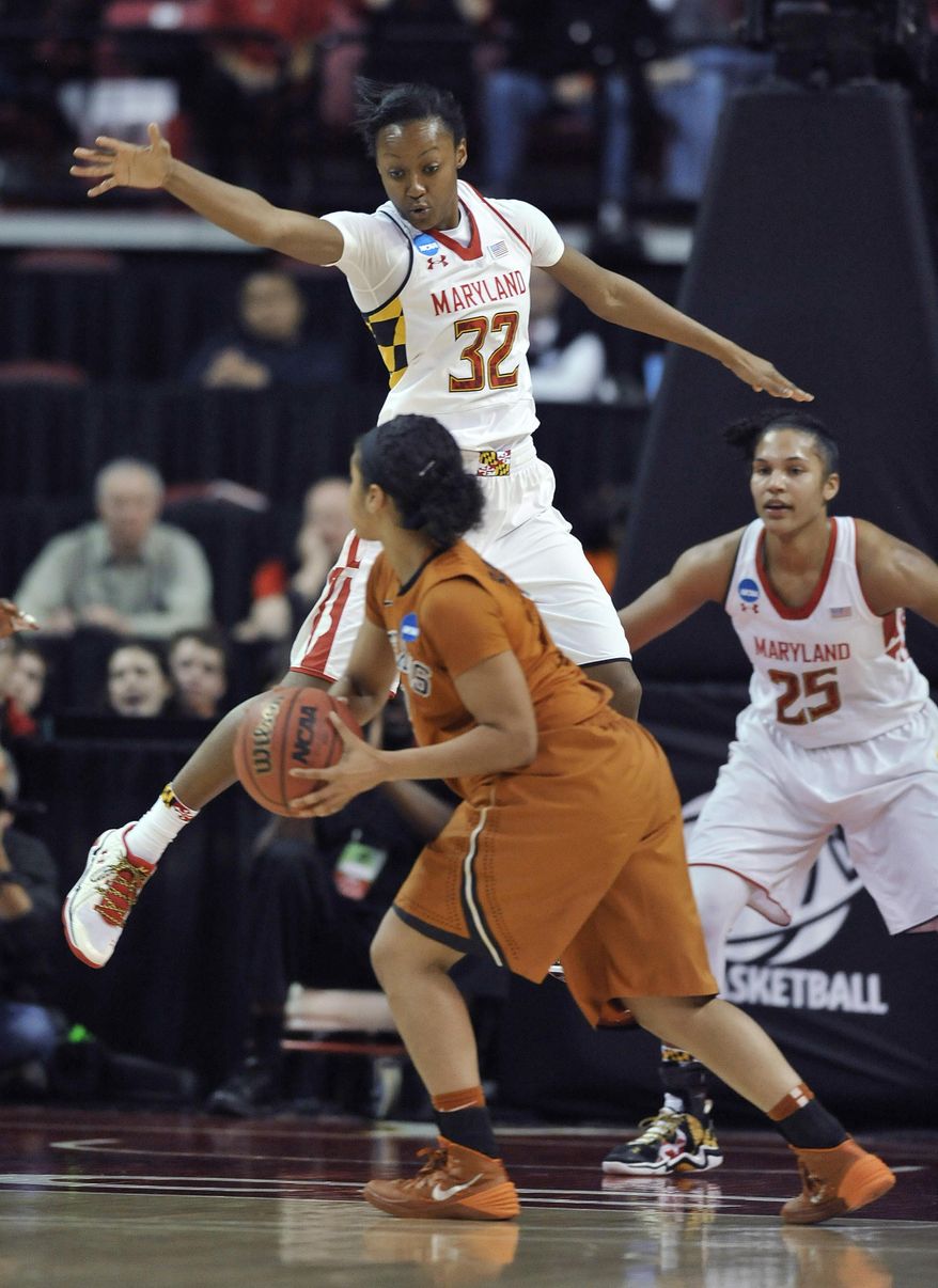 Maryland's Shatori Walker-Kimbrough (32) defends Texas' Celino Rodrigo during the second half of a second-round game in the NCAA women's college basketball tournament, Tuesday, March 25, 2014, in College Park, Md. Maryland won 69-64. (AP Photo/Gail Burton)