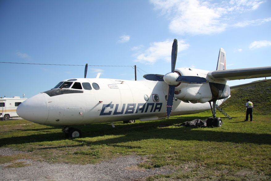 In this March 11, 2014 photo, a Cubana airlines Antonov 24 turboprop is ready for an emergency drill with local firefighters and EMT personnel at Key West International Airport. The Cuban Antonov 24 plane was hijacked in 2003. It was one of three Cuban planes that landed in Key West within a six month period, two of which were hijacked. All three were later auctioned off, but the Antonov 24 remains in Key West. None of the purchasers were able to get FAA authorization to fly the plane because it is still registered in Cuba. (AP Photo/Christine Armario)