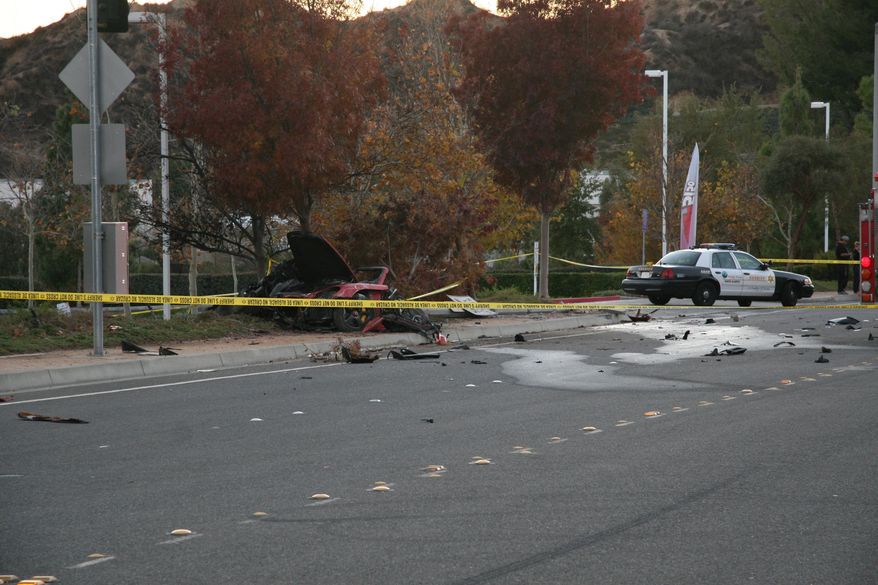 This Nov. 30, 2013 photo released by the Los Angeles County Sheriff Department on Tuesday, March 25, 2014, shows the wreckage of a Porsche that crashed into a light pole in Valencia, Calif. Crash investigators have determined that the car carrying "Fast & Furious" star Paul Walker was traveling up to 90 mph (151 kph) when it went out of control on a city street and smashed into a light pole, killing the actor and his friend Roger Rodas. A person who has reviewed the investigators’ report told The Associated Press that it concluded unsafe driving, not  mechanical problems, caused the crash. The person requested anonymity because the report has not been officially released yet. (AP Photo/Los Angeles County Sheriff)