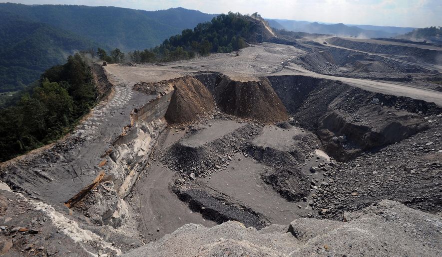 This Sept. 18, 2008 file photo shows a mountaintop removal mining site at Kayford Mountain, W.Va. The House is taking up a bill to prevent the Obama administration from imposing a stream-protection rule for coal mining that government experts say would eliminate thousands of jobs. The rules are supposed to replace Bush-era regulations that set up buffer zones around streams and were aimed chiefly at mountaintop removal mining in Appalachia. Republicans say they are part of Obama's "war on coal.'' (AP Photo/Jeff Gentner, File)