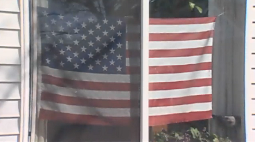 An Oregon grandmother received a letter threatening her with eviction if she did not remove an American flag from her front window that the letter referred to as "colored drapes." (KGW 8)