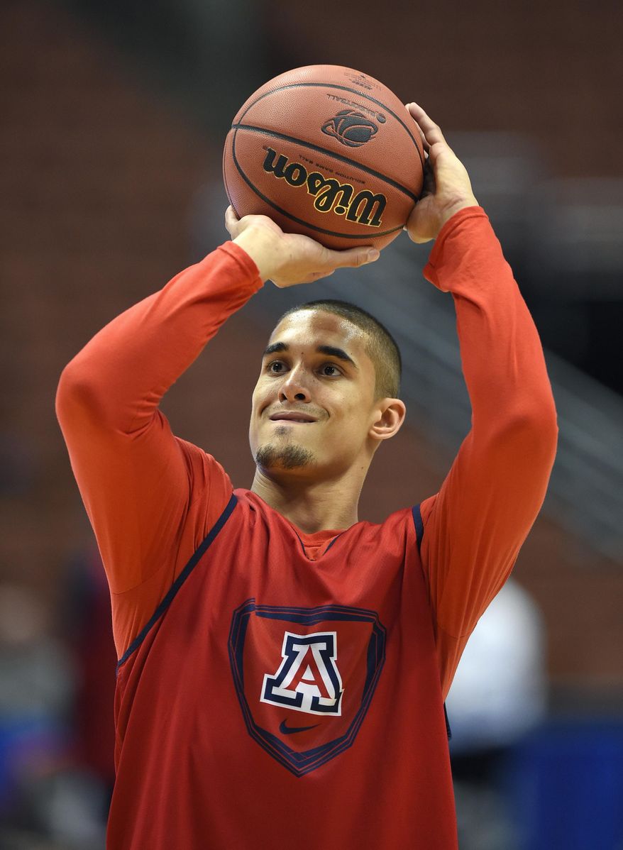 Arizona guard Nick Johnson shoots a free throw during practice at the NCAA college basketball tournament, Wednesday, March 26, 2014, in Anaheim, Calif. Arizona is scheduled to play San Diego State on Thursday in a regional semifinal. (AP Photo/Mark J. Terrill)