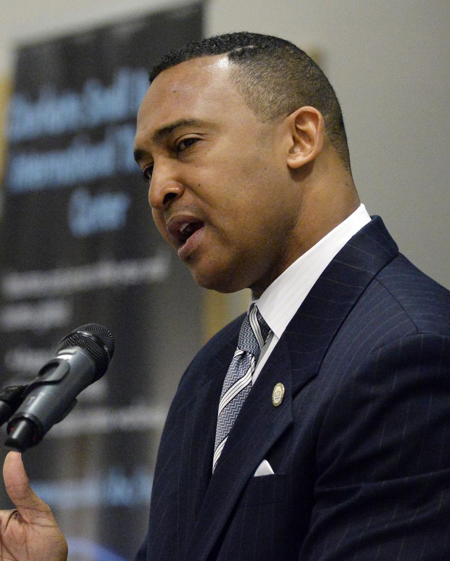 In this March 12, 2014 photo, Charlotte Mayor Patrick Cannon speaks at the Central Piedmont Community College Global Competitiveness and Transformational Thinking Summit, in Charlotte, N.C. U.S. Attorney Anne Tompkins said Wednesday, March 26, 2014, that Cannon is facing theft and bribery charges. Tompkins says Cannon solicited and accepted bribes from undercover FBI agents posing as real estate developers who wanted to do business in Charlotte. (AP Photo/The Charlotte Observer, Jeff Willhelm) MAGS OUT; TV OUT; NEWSPAPER INTERNET ONLY