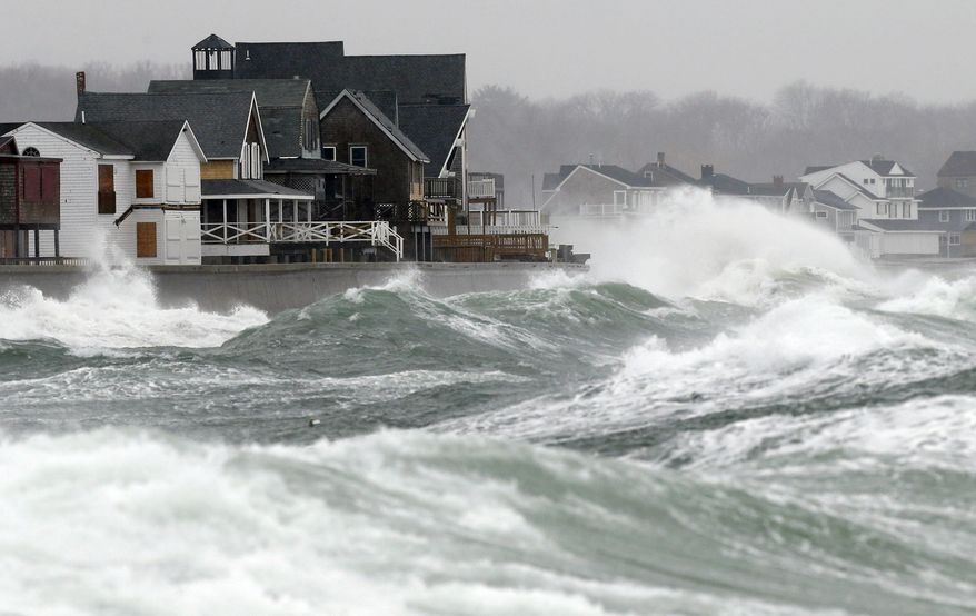 Wind-driven waves come ashore in Scituate, Mass., Wednesday, March 26, 2014. Cape Cod and the islands were expected to bear the brunt of the spring storm that struck full force Wednesday. The storm could drop up to 10 inches of snow. (AP Photo/Michael Dwyer)